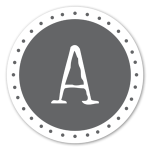 A sticker with the grey monogram 