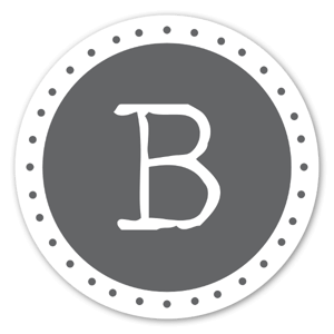 A sticker with the grey monogram 