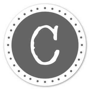 A sticker with the grey monogram 