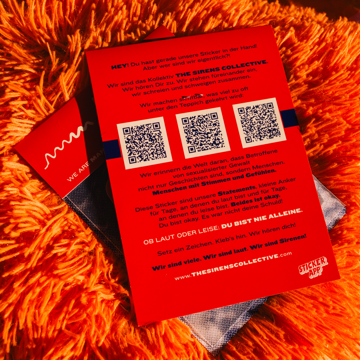 Red sticker pack with QR codes. Includes "THE SIRENS COLLECTIVE" and "STICKERAPP" logos.