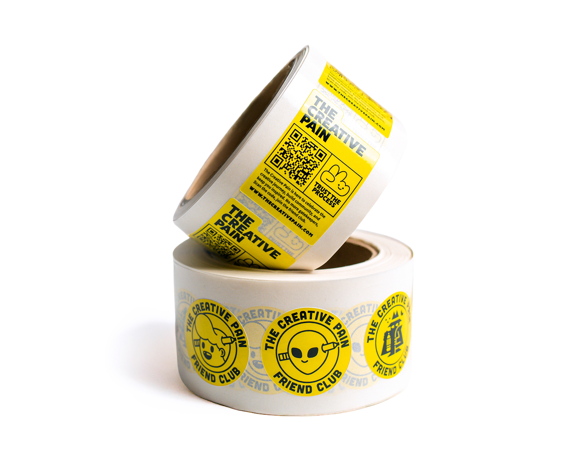 Two rolls of labels on roll with yellow labels featuring the text, "The Creative Pain Friend Club," against a white background.