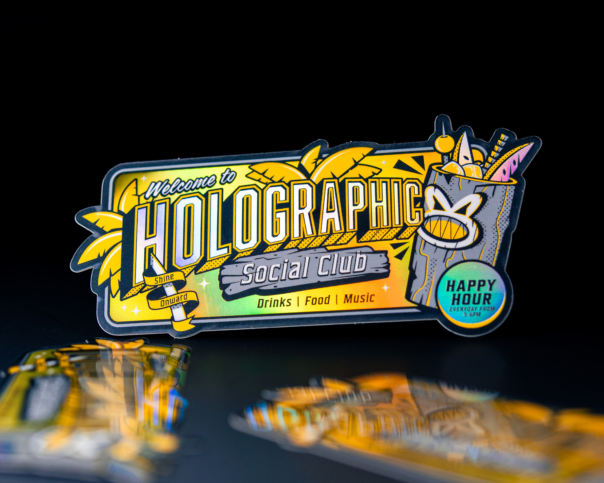 Colorful sticker for "Holographic Social Club," featuring tropical drinks and decor, with text promoting drinks, food, and music.