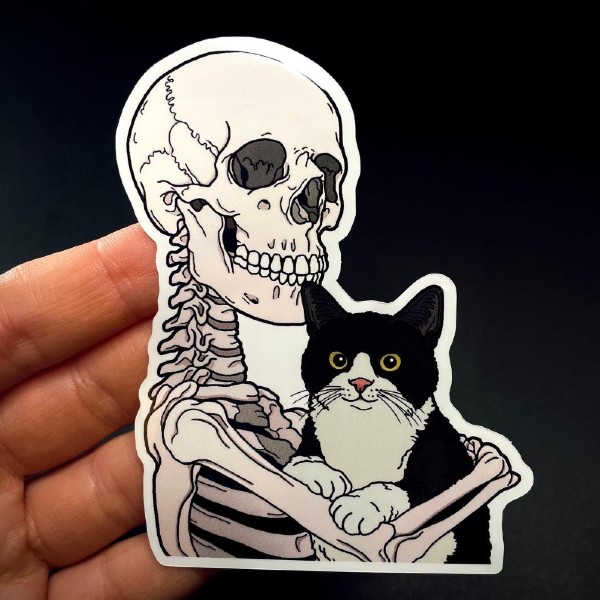 Sticker of skeleton holding a black and white cat.