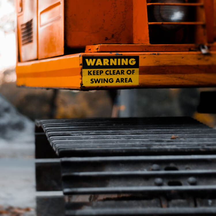 Heavy duty sticker warning sign on the back of a truck.