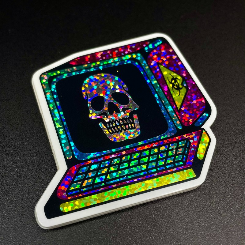 Glitter sticker of computer with a skull